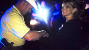 PAULA NELSON PUT ON A BRAVE FACE DURING HER ARREST BASED ON THIS PHOTO POSTED ON HER FACEBOOK PAGE. (Photo by Kevin Lance)