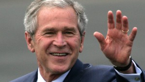 U.S. President George W. Bush waves upon arrival at RAF Aldg