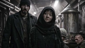 Chris Evans and Ko Ah-sung ponder how to get to the front of the train in Snowpiercer.