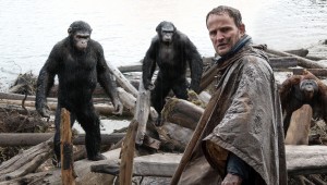 Jason Clarke (foreground) tries to make peace with our new primate overlords in Dawn of the Planet of the Apes.