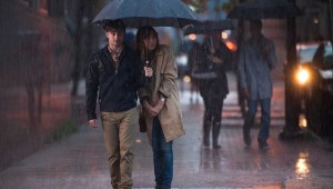 Daniel Radcliffe and Zoe Kazan share an umbrella in What If.