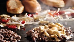 Philly cheesesteak, made with “real” Cheez Whiz, on the grill. Courtesy Facebook.