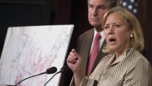 Senator Mary Landrieu, a Democrat from Louisiana, right, speaks as Senator Joe Manchin, a Democrat from West Virginia, looks on during a news conference.