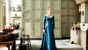Jessica Chastain wanders the kitchen area in Miss Julie.