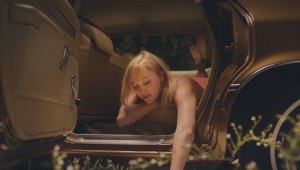Maika Monroe enjoys a serene moment before she catches It in It Follows.