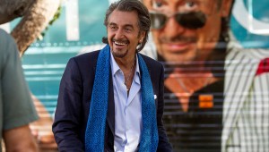 Al Pacino cracks a smile in front of his tour bus in Danny Collins.
