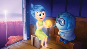 Aboard a train of thought, Joy and Sadness regard one of Riley's happy memories in Inside Out.