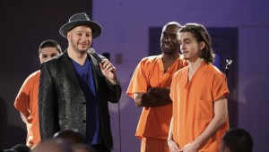 JEFF ROSS INTERVIEWING ONE OF THE LESS DANGEROUS LOOKING CONVICTS (courtesy Comedy Central).