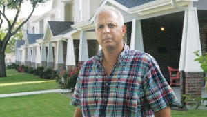 Michael Banta is concerned about the new cookie cutter houses that now occupy his beloved neighborhood of 1930s bungalows. Photo by Lee Chastain.
