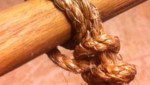 A ROUNDTURN WITH TWO HALF STITCHES.
