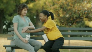 Cobie Smulders lets Gail Bean feel her pregnant stomach in Unexpected.
