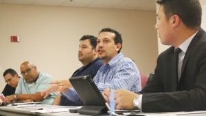 MANO volunteers discuss upcoming events at Fort Worth Central Library. Photo by Kayla Stigall.