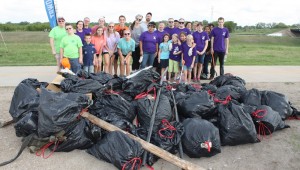 VOLUNTEEERS AT LAST YEAR'S TRINITY RIVER TRASH BASH SHOW OFF THEIR HAUL. (photo courtesy of Trinity River Vision Authority)