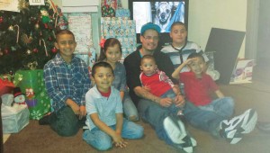 DANIEL BRUMLEY WITH SIX OF HIS SEVEN CHILDREN DURING A CHRISTMAS CELEBRATION IN 2014. (photo courtesy of Jessica Castillo).