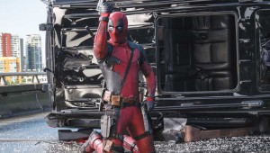 Ryan Reynolds strikes a pose after killing a bunch of bad guys in Deadpool.