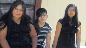 Linda Guerrero (left) and her daughters Brianna (middle) and Jasmine are still dealing with the loss of the man they loved. Photo by Madeleina Gorman.