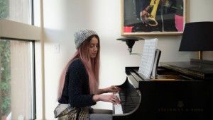 Amber Heard tickles the ivories for "One More Time."