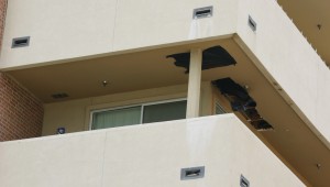 Rotted door jambs and patched holes in balcony ceilings are among the obvious damages. Photo by Jeff Prince.