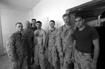 Members of a Bravo Company “hunter/killer” squad pose after a night mission.