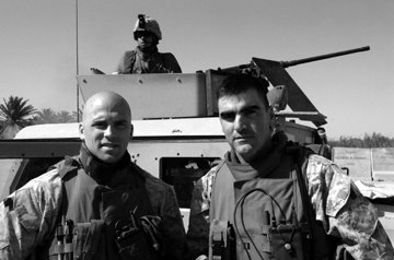 1st Sgt. Chris Reed and Capt. Bill Allen IV prepare for a mission to Al Taqaddum Airbase. Reed was attacked with an IED as he returned. No one was injured. 1st Sgt. Chris Reed and Capt. Bill Allen IV prepare for a mission to Al Taqaddum Airbase. Reed was attacked with an IED as he returned. No one was injured.