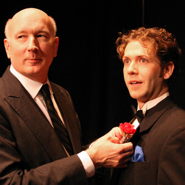 Jim Covault shows Regan Adair how to wear one’s lapel in ‘Right Ho, Jeeves.’