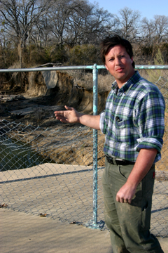 Ecologist Mark O’Leary said the sidewalk shown behind him collapsed due to Johnson Creek deterioration.
