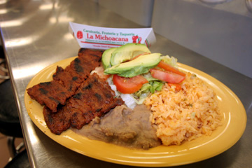 Beef strips with rice, beans, avocado, and corn tortillas, all for under a fin at La Michoacana.