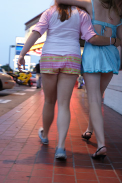 The sober girl on the left is helping the intoxicated girl on the right make it to the Headbangers Ball, but she was intercepted by a security guard and turned away.