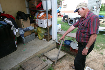 Clark said the lack of a step between Ruby Walker’s porch and yard violates federal disability regulations and city building codes.