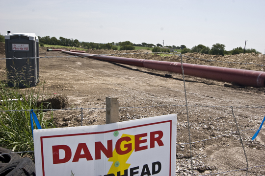 The sign in rural Denton County warns of danger, but according to Angela Hartman, landman for Cherokee Horn: “There’s a lot of misinformation ... . The concerns are a little bit overblown.”