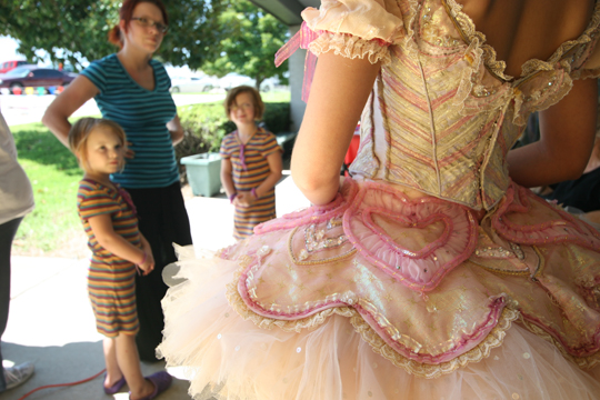Little girls’ ballerina dreams come true as they line up to pose with a dancer for $20 a shot. Naomi Vaughan