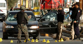 The driver of this car was shot to death as he waited at a traffic light in Juarez three weeks ago. Courtesy El Diario de Juarez