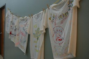 T-shirts decorated by survivors of domestic violence line the walls inside the SafeHaven location in Arlington.