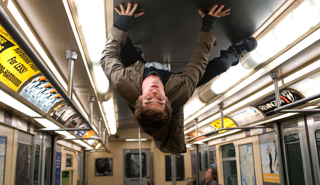 Andrew Garfield hits the ceiling of a New York City subway car in The Amazing Spider-Man.