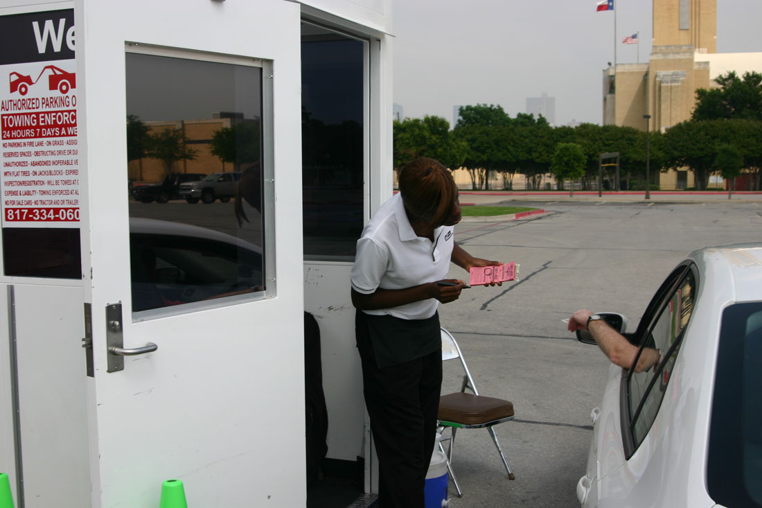 Standard Parking employees collect parking fees on city lots in the Cultural District. Jeff Price