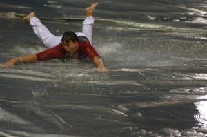 Rain turned an infield tarp into a huge Slip ’n Slide.