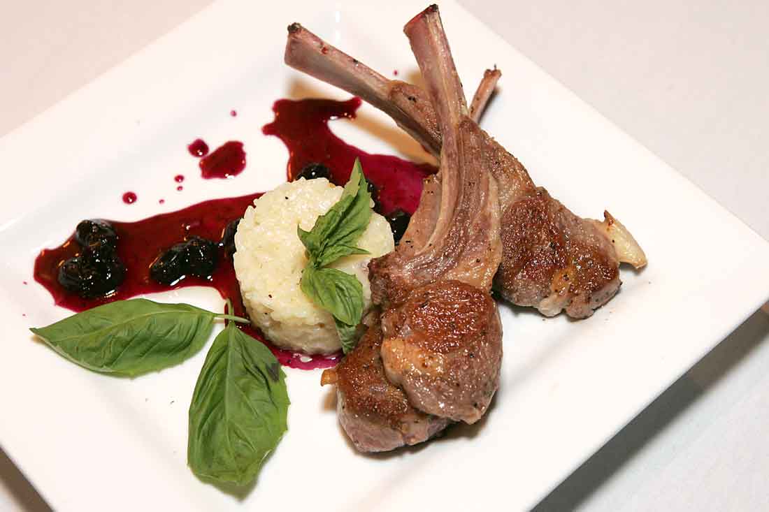The Australian lamb chops with risotto and blueberry chutney are popular at The Wild Mushroom. Lee Chastain