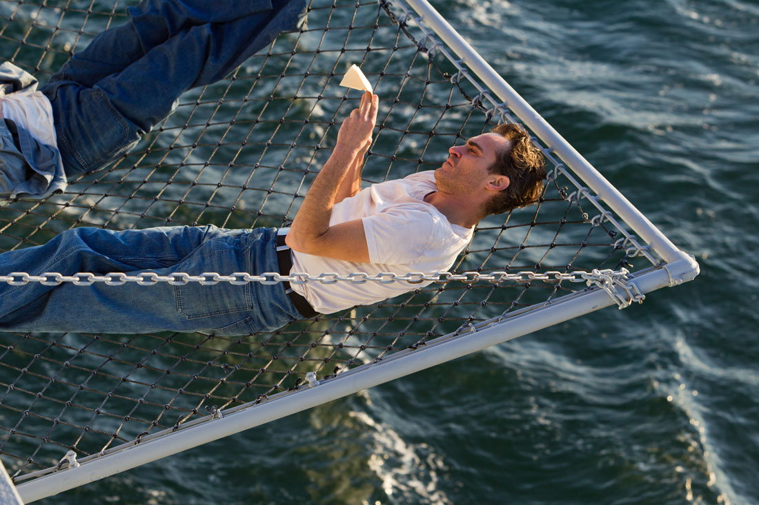 Joaquin Phoenix lounges on an aircraft carrier in The Master.