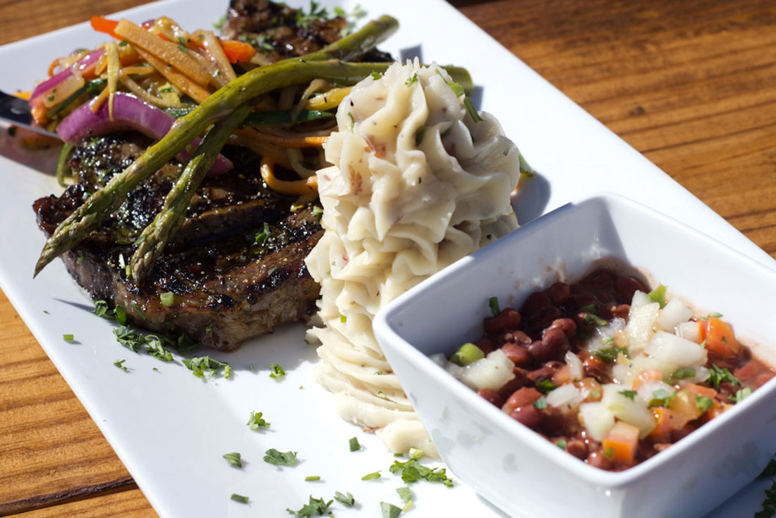 Buffalo West serves up a wonderfully plated 12-oz. rib-eye with mashed potatoes, field greens, and sautéed veggies. Chase Martinez