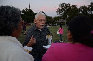 Terry Thompson, a Democratic precinct chair, passes out voter registration forms at a gathering in South Hemphill Heights. 