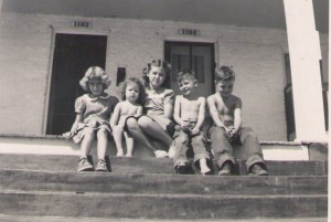 The three George children shared a side porch along Montgomery Street with neighbors in the fall of 1952. Courtesy Sylvia Belle George Walls