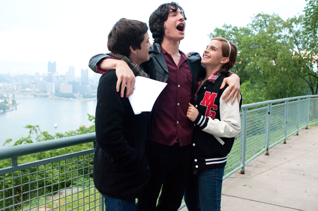 Logan Lerman, Ezra Miller, and Emma Watson celebrate a high-school triumph in The Perks of Being a Wallflower.