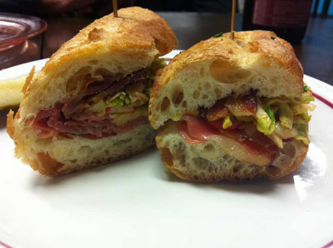 The cherry-wood smoked bacon, prosciutto, and Eagle Mountain gouda sandwich is available at Magnolia Cheese Company.