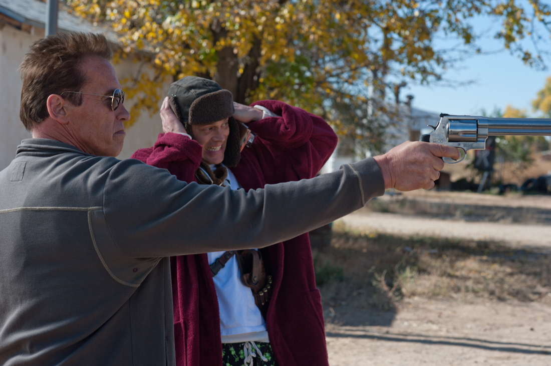 Arnold Schwarzenegger and Johnny Knoxville handle a big-ass gun in The Last Stand.