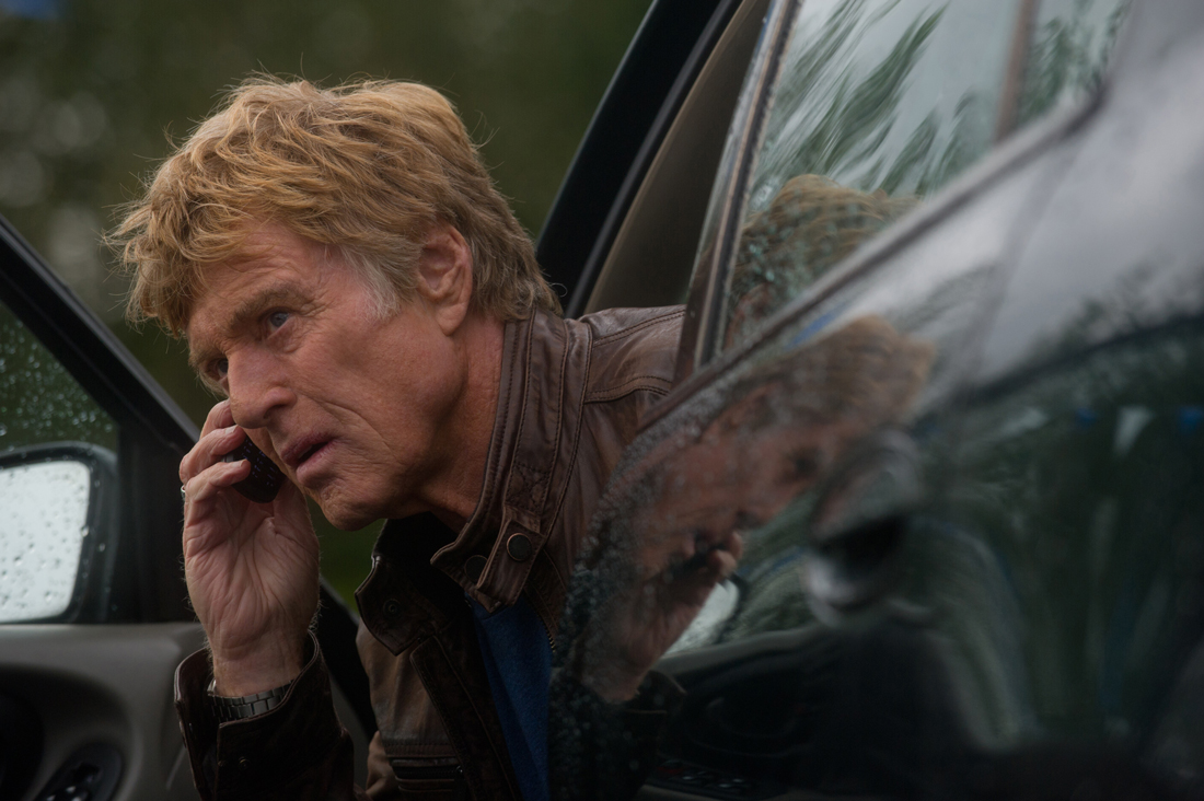 Robert Redford makes a phone call before the cops can trace his signal in The Company You Keep.