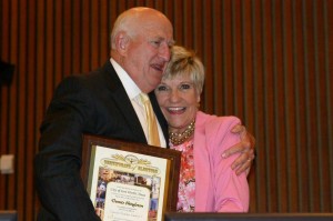 The ebullient Price gives Dennis Shingleton a hug in recognition of his recent re-election to the city council. Jeff Prince