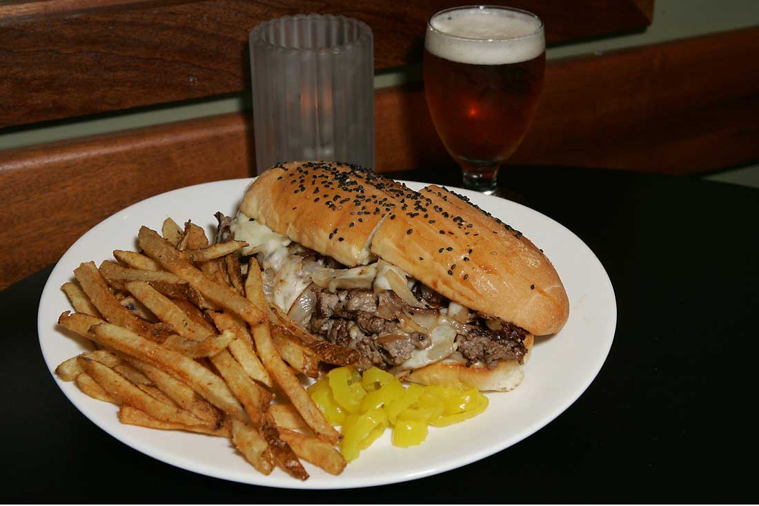 The Live Oak’s shaved rib-eye sandwich is “terrific all around.” Lee Chastain