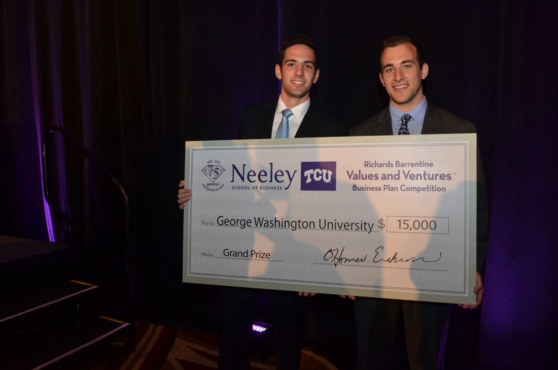 Herman, left, and Fox couldn’t fit their presentation check into carry-on luggage, but the proceeds will fit nicely into their business. Photo by B.J. Lacasse, courtesy TCU