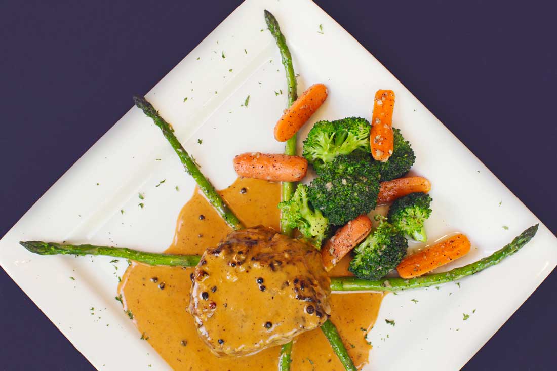 Macaluso’s takes a semi-nontraditional approach to Italian cuisine, as this filet with peppercorn sauce and asparagus clearly shows. Adrien P. Maroney