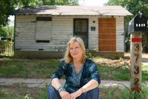FEATURE_2 Clark, in front of one of her childhood homes: “We were living on beans.” Jeff Prince